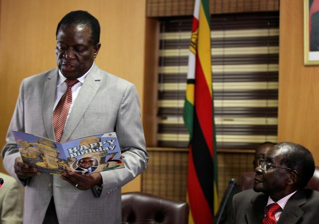 Zimbabwe's President Robert Mugabe looks on as his deputy Emmerson Mnangagwa reads a card during Mugabe's 93rd birthday celebrations in Harare, Zimbabwe. (Reuters File Photo) Zimbabwe's President Robert Mugabe looks on as his deputy Emmerson Mnangagwa reads a card during Mugabe's 93rd birthday celebrations in Harare, Zimbabwe. (Reuters File Photo)