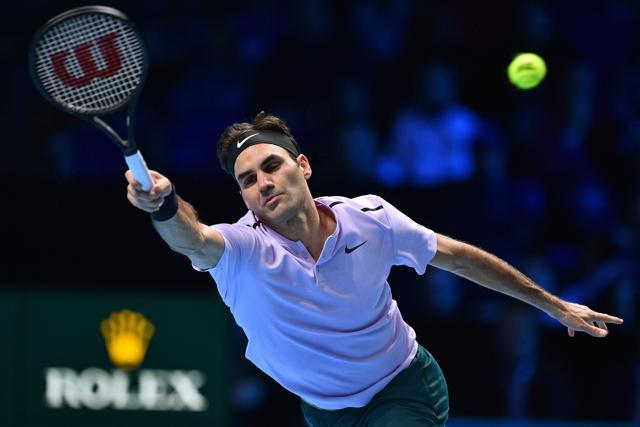 Roger Federer returns to Marin Cilic during their ATP Finals tennis encounter. (AFP)