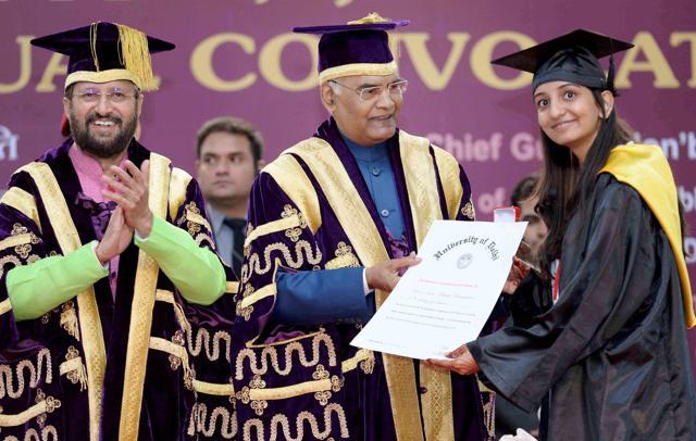 Another student receives her degree. (PTI) Another student receives her degree. (PTI)