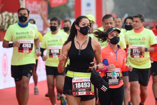 Men and women wear face mask as they take part in the Airtel Delhi Half Marathon 2017 in New Delhi on Sunday. (AFP) Men and women wear face mask as they take part in the Airtel Delhi Half Marathon 2017 in New Delhi on Sunday. (AFP)