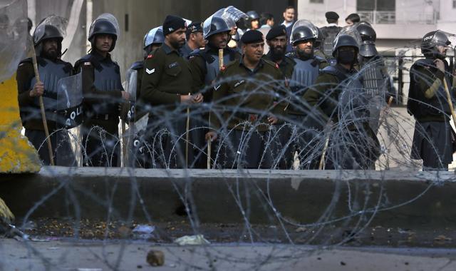 Soldiers of Frontier Constabulary stand guard at barricaded road close to the site of sit-in protest at an intersection of Islamabad. (AP) Soldiers of Frontier Constabulary stand guard at barricaded road close to the site of sit-in protest at an intersection of Islamabad. (AP)