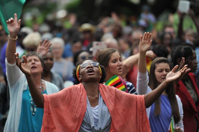 Participants in a religious gathering entitled 'Breakthrough prayer for Zimbabwe' hold their hands in the air as as they say prayers at Unity Square in Harare on November 19, 2017. (AFP Photo) Participants in a religious gathering entitled 'Breakthrough prayer for Zimbabwe' hold their hands in the air as as they say prayers at Unity Square in Harare on November 19, 2017. (AFP Photo)