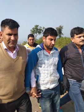 The accused (centre) being taken to the crime spot in Morni forest area of Panchkula district on Tuesday. (HT Photo) The accused (centre) being taken to the crime spot in Morni forest area of Panchkula district on Tuesday. (HT Photo)