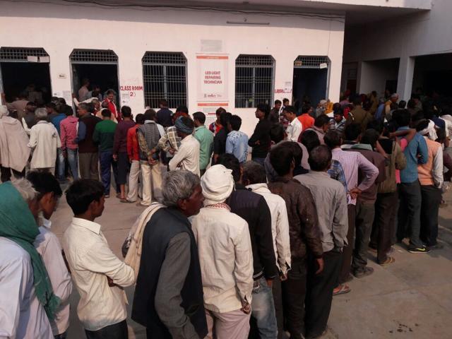 Voters queue up at a polling station in Agra. Voters queue up at a polling station in Agra.