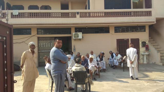 Villagers and relatives at the house of Sonu Malik near Kurukshetra. (HT Photo)