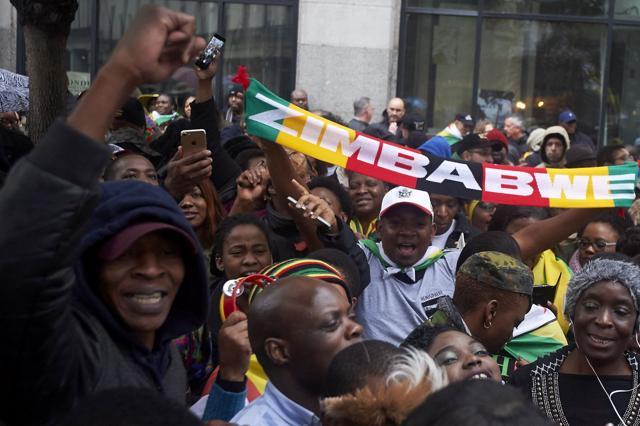 Demonstrators protest outside the Zimbabwe Embassy in London. (AFP Photo) Demonstrators protest outside the Zimbabwe Embassy in London. (AFP Photo)