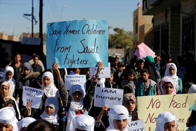 Children protest against the Saudi-led coalition outside the UN offices in Sanaa. (Reuters Photo)