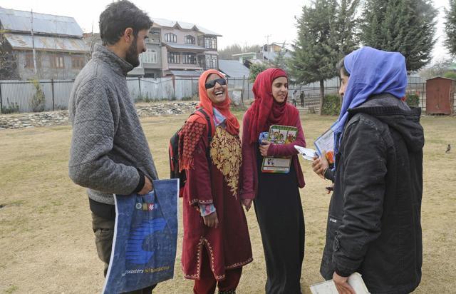 Insha Mushtaq with her friends before her exams at the centre in Shopian town of south Kashmir. (Waseem Andrabi/HT Photo) Insha Mushtaq with her friends before her exams at the centre in Shopian town of south Kashmir. (Waseem Andrabi/HT Photo)