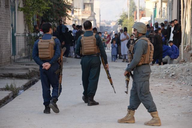 Afghan security forces stand guard near the site of a suicide attack in Jalalabad on November 23, 2017. (AFP)