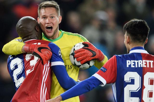 FC Basel's goalkeeper Tomas Vaclik (C) celebrates with teammates Eder Balanta (L) and Italian defender Raoul Petretta (R) after defeating Manchester United. (AFP) FC Basel's goalkeeper Tomas Vaclik (C) celebrates with teammates Eder Balanta (L) and Italian defender Raoul Petretta (R) after defeating Manchester United. (AFP)