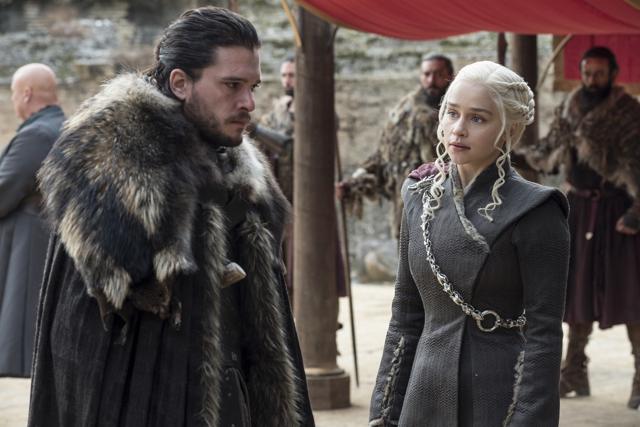 This image released by HBO shows Kit Harington, left, and Emilia Clarke on the season finale of Game of Thrones. (AP)
