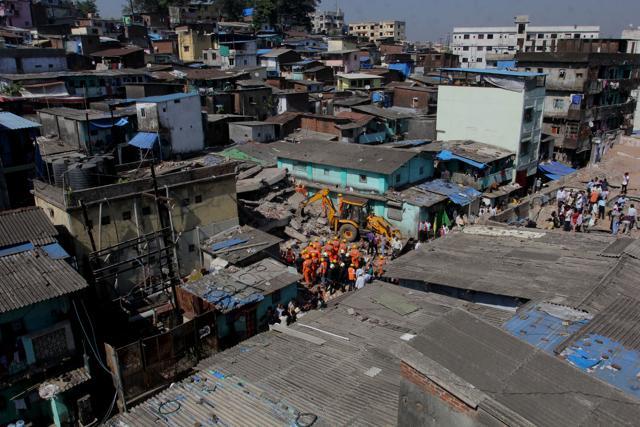 The building collapsed on single-structured houses, destroying them completely. (Praful Gangurde) The building collapsed on single-structured houses, destroying them completely. (Praful Gangurde)