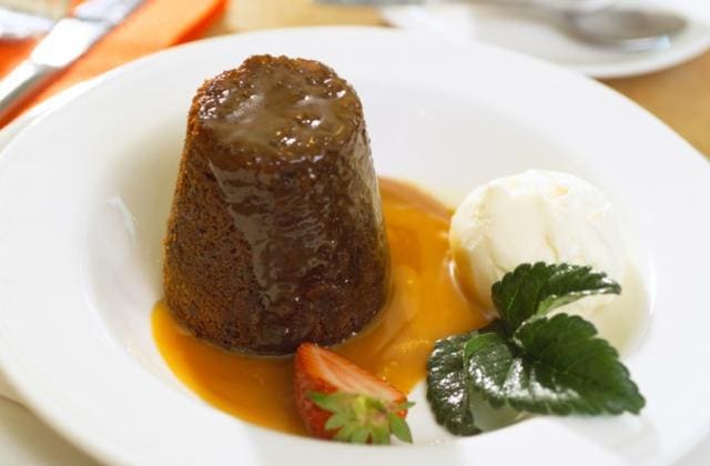 Serve date pudding with toffee sauce and sprinkle some almond flakes. (Shutterstock) Serve date pudding with toffee sauce and sprinkle some almond flakes. (Shutterstock)