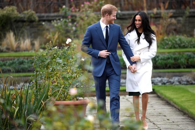 Britain's Prince Harry poses with Meghan Markle in the Sunken Garden of Kensington Palace, London, Britain. (REUTERS) Britain's Prince Harry poses with Meghan Markle in the Sunken Garden of Kensington Palace, London, Britain. (REUTERS)