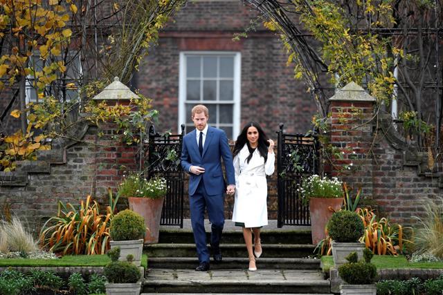 Britain's Prince Harry poses with Meghan Markle in the Sunken Garden of Kensington Palace, London, Britain. (REUTERS) Britain's Prince Harry poses with Meghan Markle in the Sunken Garden of Kensington Palace, London, Britain. (REUTERS)