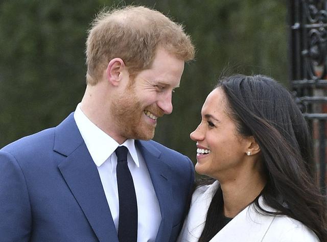 Britain's Prince Harry and Meghan Markle smile as they pose for the media in the grounds of Kensington Palace in London. (AP) Britain's Prince Harry and Meghan Markle smile as they pose for the media in the grounds of Kensington Palace in London. (AP)