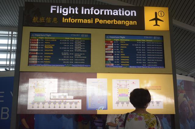 A flight information board shows cancelled flights at Ngurah Rai International Airport in Bali, Indonesia, Monday. (AP Photo)