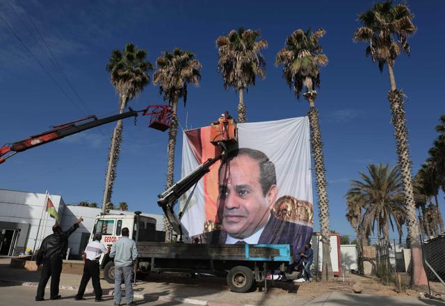 A portrait of Egyptian President Abdel Fattah al-Sisi hangs the Rafah border crossing with Egypt. (AFP Photo) A portrait of Egyptian President Abdel Fattah al-Sisi hangs the Rafah border crossing with Egypt. (AFP Photo)