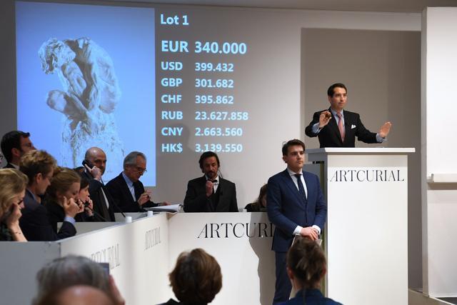 Auctioneer Matthieu Fournier (R) calls the sale at 340,000 euros for the sculpture "L'Homme Penche. " (AFP) Auctioneer Matthieu Fournier (R) calls the sale at 340,000 euros for the sculpture "L'Homme Penche. " (AFP)
