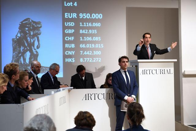 Auctioneer Matthieu Fournier (R) calls the sale at 950,000 euros for the sculpture "L'Abandon. " (AFP) Auctioneer Matthieu Fournier (R) calls the sale at 950,000 euros for the sculpture "L'Abandon. " (AFP)