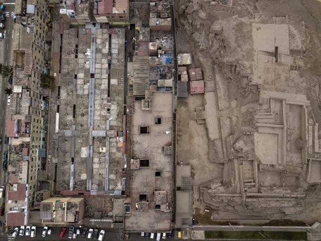 The pre-Columbian archeological site Huantille, right, is hugged by apartments a market in the Cercado de Lima area of Lima, Peru. (AP) The pre-Columbian archeological site Huantille, right, is hugged by apartments a market in the Cercado de Lima area of Lima, Peru. (AP)