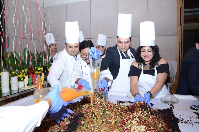 Participants raise a toast to the festive season with the cake mixing ceremony at Taj City Centre, Gurgaon.