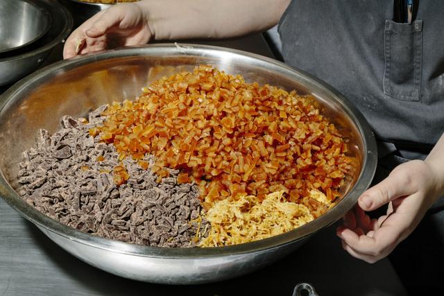 Baker Avery Ruzicka with ingredients, including dark chocolate and candied orange peel, for a batch of panettone at Manresa Breads. (NYT) Baker Avery Ruzicka with ingredients, including dark chocolate and candied orange peel, for a batch of panettone at Manresa Breads. (NYT)