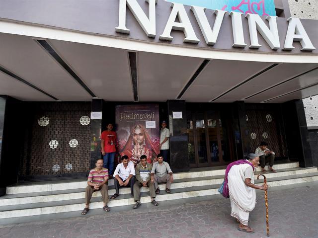 Employees of a cinema hall stop work and close the entrance gate for 15 minutes in Kolkata on Tuesday as a mark of protest against the anti-Padmavati campaign in some parts of the country and the threat issued against West Bengal chief minister Mamata Banerjee and actor of the film Deepika Padukone. (PTI)