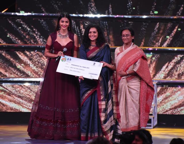 Uttar Pradesh Tourism Minister Prof. Rita Bahuguna Joshi presents the Silver Peacock Award for the Best Actor (Female) to Parvathy Thiruvoth Kottuvatta for the Malayalam film Take Off at the closing ceremony of 48th International Film Festival of India (IFFI-2017) in Panaji, Goa on November 28, 2017. (IANS) Uttar Pradesh Tourism Minister Prof. Rita Bahuguna Joshi presents the Silver Peacock Award for the Best Actor (Female) to Parvathy Thiruvoth Kottuvatta for the Malayalam film Take Off at the closing ceremony of 48th International Film Festival of India (IFFI-2017) in Panaji, Goa on November 28, 2017. (IANS)