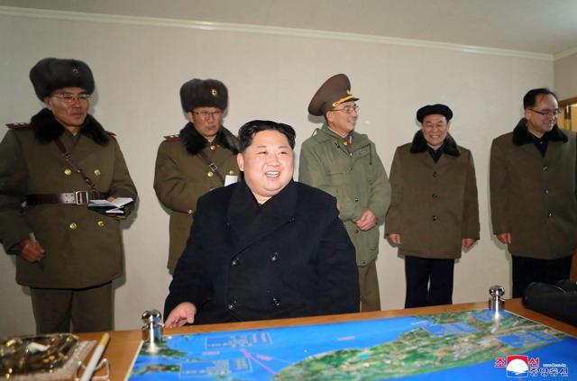 CORRECTION - This photo taken on November 29, 2017 and released on November 30, 2017 by North Korea's official Korean Central News Agency (KCNA) shows North Korean leader Kim Jong-Un looking at launching of the Hwasong-15 missile which is capable of reaching all parts of the US. (AFP PHOTO/KCNA VIA KNS) CORRECTION - This photo taken on November 29, 2017 and released on November 30, 2017 by North Korea's official Korean Central News Agency (KCNA) shows North Korean leader Kim Jong-Un looking at launching of the Hwasong-15 missile which is capable of reaching all parts of the US. (AFP PHOTO/KCNA VIA KNS)