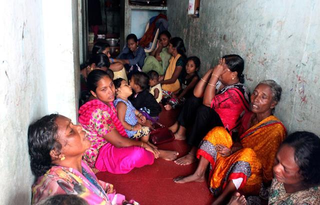 Relatives of fishermen stranded at sea wait for their kin to come home. (Vivek R Nair/HT PHOTO)