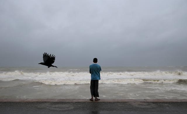 A Sri Lankan man watches the Indian ocean in Colombo, Sri Lanka, Thursday, Nov. 30, 2017. (AP) A Sri Lankan man watches the Indian ocean in Colombo, Sri Lanka, Thursday, Nov. 30, 2017. (AP)
