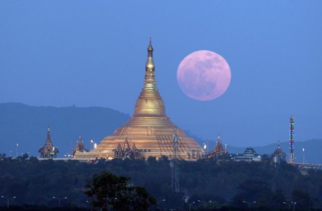 Moon rises behind the Uppatasanti Pagoda - seen from Naypyitaw, Myanmar. (AP) Moon rises behind the Uppatasanti Pagoda - seen from Naypyitaw, Myanmar. (AP)