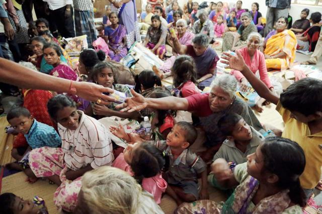 People receive essential commodities at a relief camp following the impact of cyclone Ockhi in the Kanyakumari district on Saturday. (PTI) People receive essential commodities at a relief camp following the impact of cyclone Ockhi in the Kanyakumari district on Saturday. (PTI)