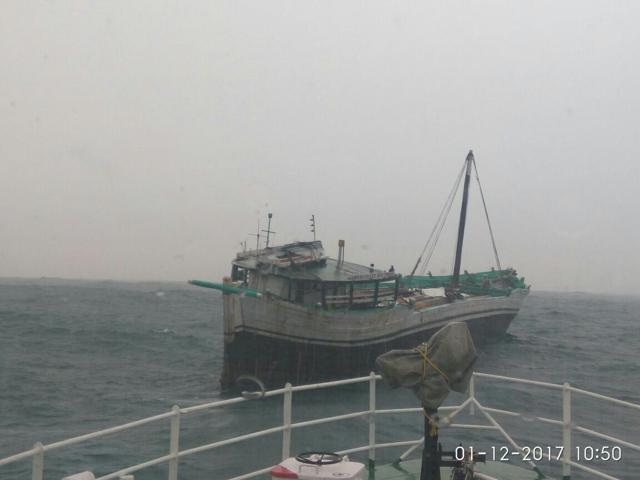A Coast Guard ship towing a fishing boat to shore. (Handout by Defence ministry) A Coast Guard ship towing a fishing boat to shore. (Handout by Defence ministry)