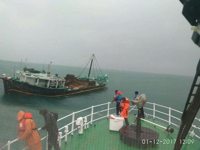 A Coast Guard ship towing a fishing boat. (Handout by Defence ministry) A Coast Guard ship towing a fishing boat. (Handout by Defence ministry)