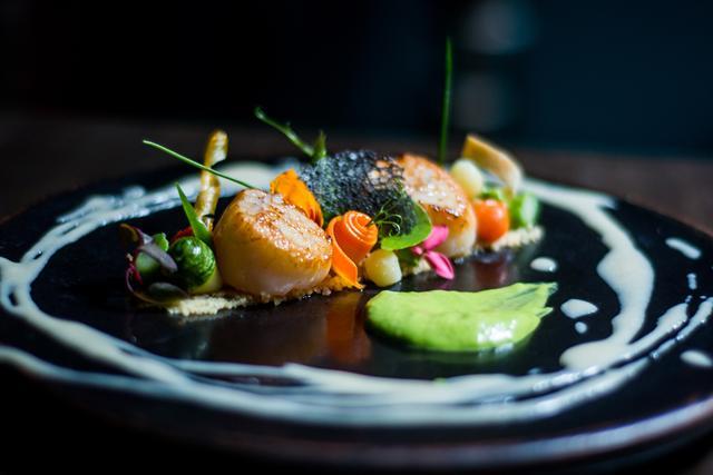 Whisky-flamed scallops at Slink and Bardot where the seafood is sourced from local fishermen Whisky-flamed scallops at Slink and Bardot where the seafood is sourced from local fishermen