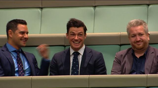 In this TV grab released by Australian Parliament via Seven News, Ryan Bolger (centre) reacts as his partner and Australian lawmaker Tim Wilson pops the question in Parliament in Canberra on December 4, 2017. (AFP) In this TV grab released by Australian Parliament via Seven News, Ryan Bolger (centre) reacts as his partner and Australian lawmaker Tim Wilson pops the question in Parliament in Canberra on December 4, 2017. (AFP)