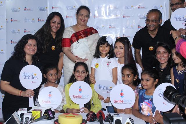 Aishwarya Rai Bachchan along with her mother Brindya Rai, daughter Aaradhya Bachchan and children born with cleft lips and palates of 'Smile Train' celebrates her father Krishnaraj Rai's birth anniversary at Shushrusha Hospital, in Mumbai. (IANS) Aishwarya Rai Bachchan along with her mother Brindya Rai, daughter Aaradhya Bachchan and children born with cleft lips and palates of 'Smile Train' celebrates her father Krishnaraj Rai's birth anniversary at Shushrusha Hospital, in Mumbai. (IANS)
