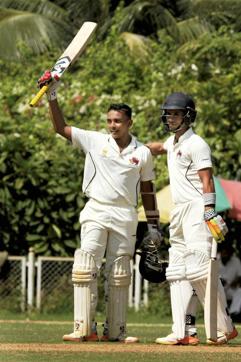 Mumbai's Prithvi Shaw celebrates his century as Siddhesh Lad greets him during their Ranji Trophy match against Tamil Nadu at MCA in Mumbai earlier this season. (PTI)