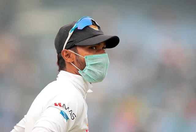 A Sri Lankan player, wearing a face mask, stands at Delhi’s Feroz Shah Kotla. (REUTERS) A Sri Lankan player, wearing a face mask, stands at Delhi’s Feroz Shah Kotla. (REUTERS)