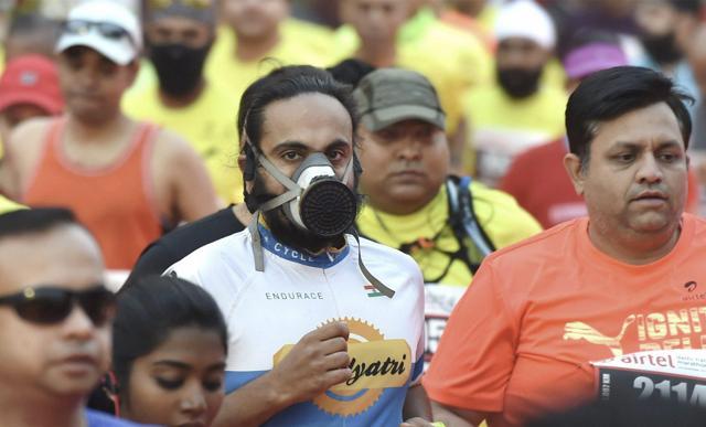 New Delhi: A participant, wearing mask, runs during the Airtel Delhi Half Marathon 2017 in New Delhi on Sunday. PTI Photo by Manvender Vashist (PTI11_19_2017_000165B) (PTI) New Delhi: A participant, wearing mask, runs during the Airtel Delhi Half Marathon 2017 in New Delhi on Sunday. PTI Photo by Manvender Vashist (PTI11_19_2017_000165B) (PTI)