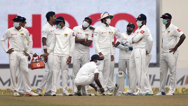 Sri Lankan players get together as they wait for third umpire decision for the wicket of India's Ajinkya Rahane during the fourth day of their third Test match in New Delhi on Tuesday. (AP) Sri Lankan players get together as they wait for third umpire decision for the wicket of India's Ajinkya Rahane during the fourth day of their third Test match in New Delhi on Tuesday. (AP)