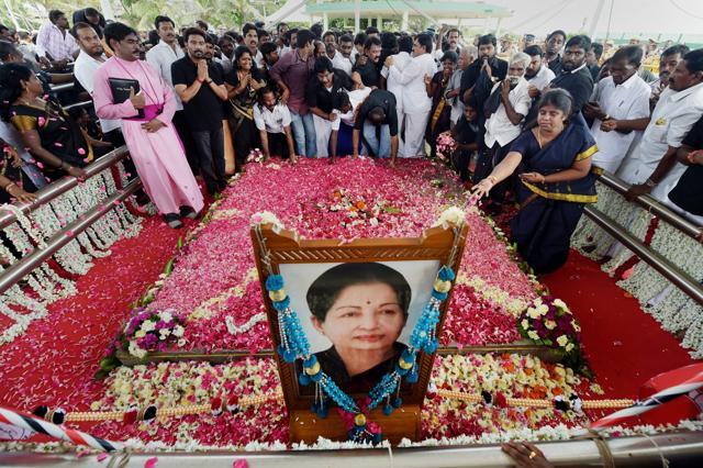 People paying their respects to the late AIADMK supremo and former chief minister J Jayalalithaa on her first death anniversary at her memorial near shores of Marina in Chennai on Tuesday. (PTI Photo) People paying their respects to the late AIADMK supremo and former chief minister J Jayalalithaa on her first death anniversary at her memorial near shores of Marina in Chennai on Tuesday. (PTI Photo)