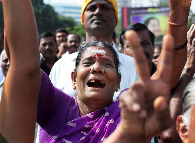 An ADMK woman member gets emotional as she pays tribute to former chief minister J Jayalalithaa on her first death anniversary in Coimbatore on Tuesday. (PTI Photo) An ADMK woman member gets emotional as she pays tribute to former chief minister J Jayalalithaa on her first death anniversary in Coimbatore on Tuesday. (PTI Photo)