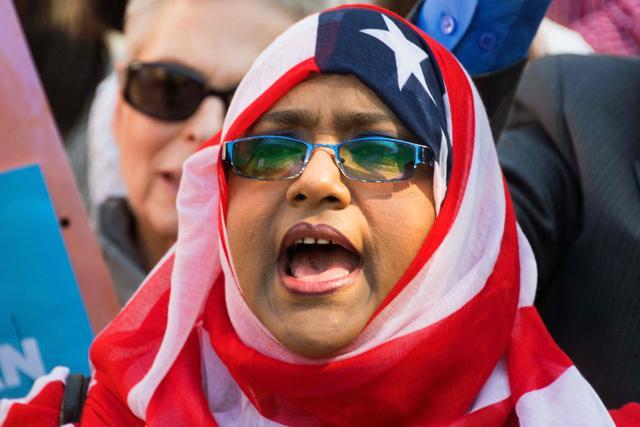 A demonstrator chants during a rally and march "to protest discriminatory policies that unlawfully target and hurt American Muslim and immigrant communities across the country" in Washington, DC. (AFP file phot) A demonstrator chants during a rally and march "to protest discriminatory policies that unlawfully target and hurt American Muslim and immigrant communities across the country" in Washington, DC. (AFP file phot)