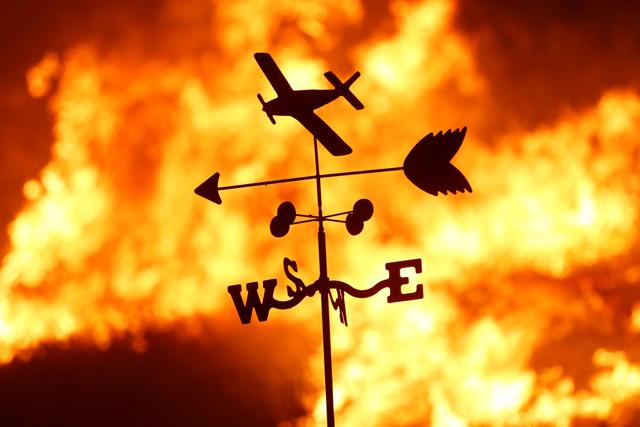 A weather vane is pictured on a ranch during the Creek Fire in the San Fernando Valley north of Los Angeles, in Sylmar, California, US, December 5. (Reuters Photo) A weather vane is pictured on a ranch during the Creek Fire in the San Fernando Valley north of Los Angeles, in Sylmar, California, US, December 5. (Reuters Photo)