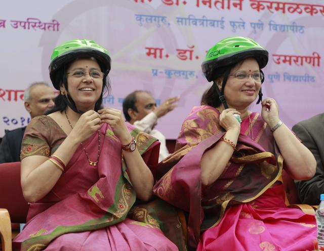 Medha Kulkarni (L) and Mukta Tilak wear bicycle helmet to extend their support to the PEDL share-a-cycle project at SSPU in Pune. (HT PHOTO) Medha Kulkarni (L) and Mukta Tilak wear bicycle helmet to extend their support to the PEDL share-a-cycle project at SSPU in Pune. (HT PHOTO)