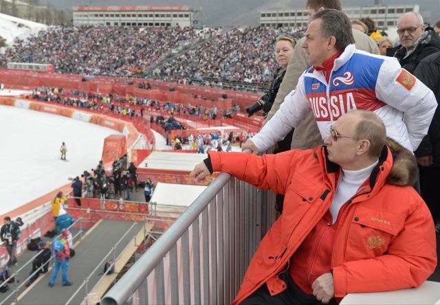 In this file photo taken Saturday, March 8, 2014, Russian President Vladimir Putin, foreground, watches downhill ski competition of the 2014 Winter Paralympics in Roza Khutor mountain district of Sochi, Russia, as Russia's sports minister Vitaly Mutko stands behind. (AP) In this file photo taken Saturday, March 8, 2014, Russian President Vladimir Putin, foreground, watches downhill ski competition of the 2014 Winter Paralympics in Roza Khutor mountain district of Sochi, Russia, as Russia's sports minister Vitaly Mutko stands behind. (AP)