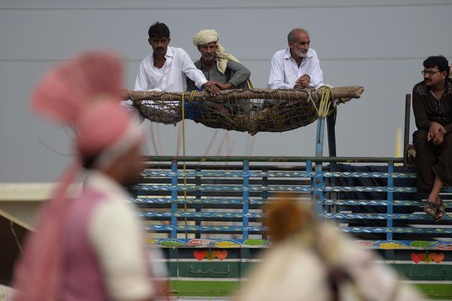 Villagers watching the tent-pegging competition. (AAMIR QURESHI/AFP) Villagers watching the tent-pegging competition. (AAMIR QURESHI/AFP)